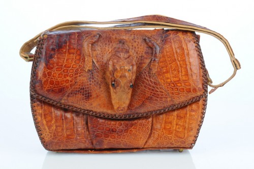 An alligator handbag of a much later date. http://www.artfire.com/ext/shop/product_view/VintageAnelia/4777103/Alligator_Handbag_with_head_feet/Bags_Purses/Handbags