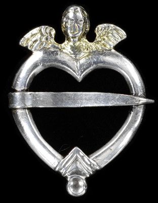 An 18th c. heart brooch http://collections.vam.ac.uk/item/O118011/ring-brooch-unknown/